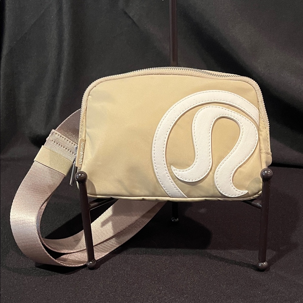 Lululemon Everywhere Belt Bag in Trench/White Opal with a large stitched logo